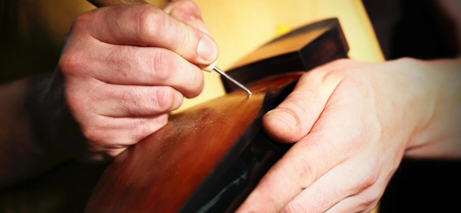 Man fixing shoe
