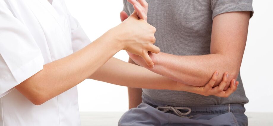 Doctor working on patient's arm
