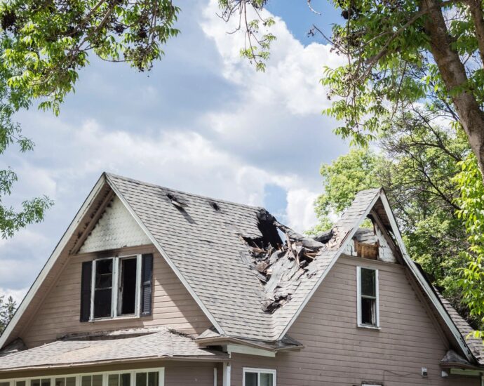 Home with severely damaged roof