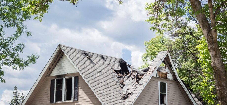 Home with severely damaged roof