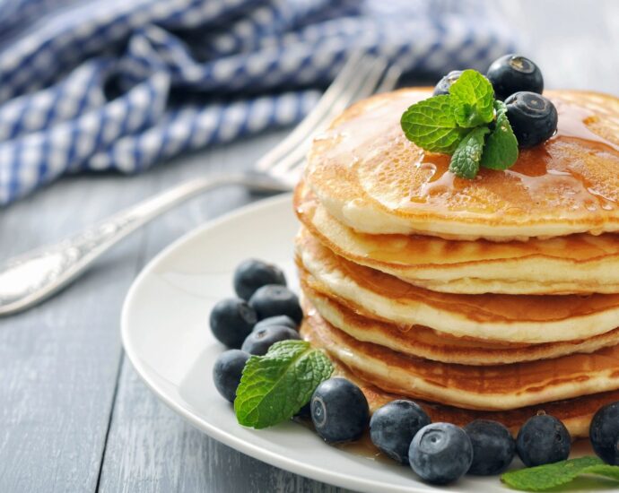 stack of pancakes with blueberries on top